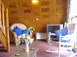 Lounge with stairs to galleried bedroom